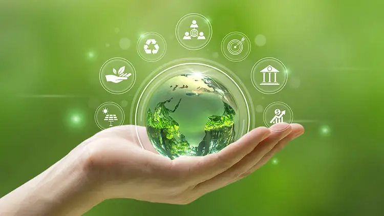 A hand holding a glass globe surrounded by icons for recycling, solar energy, and governance